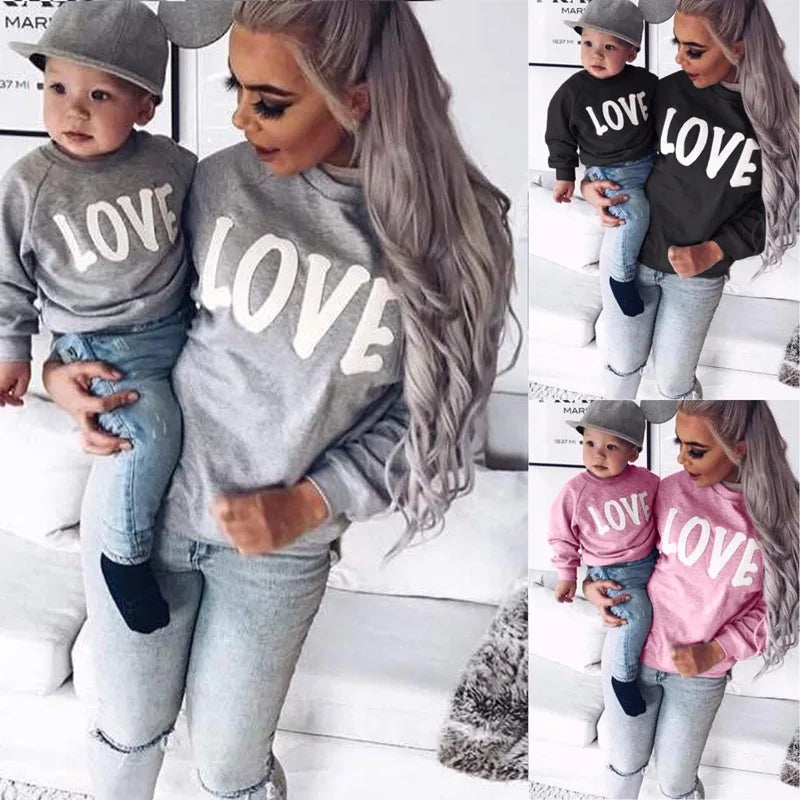Mother and baby family love matching jumpers | See:Saw Kids